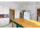 Kitchen featuring vintage cabinetry and wood countertops, creating a nostalgic cooking space at 143 Reid St, Rock Hill, SC 29730