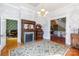 Elegant living room with a decorative fireplace, hardwood floors, and ornate details, showcasing classic charm at 143 Reid St, Rock Hill, SC 29730