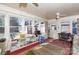 Bright sun room with large windows, flooding the space with natural light, perfect for relaxing and reading at 143 Reid St, Rock Hill, SC 29730
