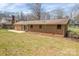 A spacious backyard featuring a patio and a clean brick house perfect for outdoor living at 1630 26Th Ne St, Hickory, NC 28601