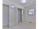 Bedroom with mirrored closet doors, carpet, and a window for natural light at 1630 26Th Ne St, Hickory, NC 28601