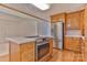 Modern kitchen featuring stainless steel appliances, tile countertops, and hardwood floors at 1630 26Th Ne St, Hickory, NC 28601