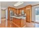 Updated kitchen with a tile-top island, stainless steel appliances, wood cabinets, and hardwood floors at 1630 26Th Ne St, Hickory, NC 28601