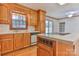 Bright kitchen with hardwood floors, tile countertops, and modern appliances, and wood cabinetry at 1630 26Th Ne St, Hickory, NC 28601