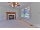 Bright living room featuring a fireplace with marble surround and a sunny bay window at 1630 26Th Ne St, Hickory, NC 28601