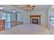 Spacious living room with fireplace, access to the kitchen and sliding glass doors to the backyard at 1630 26Th Ne St, Hickory, NC 28601
