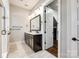 Modern bathroom featuring a double vanity, tile flooring, decorative mirrors, and a step-in shower at 1891 Felts Pkwy, Fort Mill, SC 29715