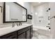 This bathroom has a dark vanity, tub and shower combo, and subway tile at 1891 Felts Pkwy, Fort Mill, SC 29715