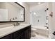 Cozy bathroom featuring a single sink vanity, framed mirror, and a tiled shower-over-tub combination at 1891 Felts Pkwy, Fort Mill, SC 29715