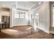 Elegant dining room with hardwood floors, a chandelier, and access to the patio at 1891 Felts Pkwy, Fort Mill, SC 29715