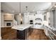 Open-concept kitchen with a large island, wine cooler, and stainless steel appliances at 1891 Felts Pkwy, Fort Mill, SC 29715