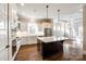 Stylish kitchen featuring a center island, stainless steel appliances, and hardwood floors at 1891 Felts Pkwy, Fort Mill, SC 29715
