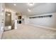 This large living room has carpet and space for entertaining at 1891 Felts Pkwy, Fort Mill, SC 29715