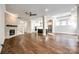 Expansive living room with hardwood floors, fireplace, and an open layout to the kitchen at 1891 Felts Pkwy, Fort Mill, SC 29715