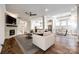 Spacious living room with hardwood floors, a fireplace, and an open layout at 1891 Felts Pkwy, Fort Mill, SC 29715