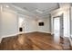 Open main bedroom with a tray ceiling, recessed lights, and ensuite bath, offering modern elegance and space at 1891 Felts Pkwy, Fort Mill, SC 29715