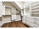Spacious walk-in closet offers custom shelving and hanging rods for optimal organization and convenience at 1891 Felts Pkwy, Fort Mill, SC 29715