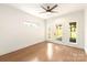 Bright bedroom featuring a ceiling fan and a door to the backyard at 1922 Hamorton Pl, Charlotte, NC 28205