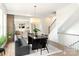 Bright dining room with a modern table and decor near the staircase with hardwood floors at 1922 Hamorton Pl, Charlotte, NC 28205