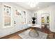 Welcoming foyer with hardwood floors, natural light, and stylish decor at 1922 Hamorton Pl, Charlotte, NC 28205