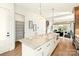 Open concept kitchen with an island, marble countertop, stainless steel appliances, and hardwood floors at 1922 Hamorton Pl, Charlotte, NC 28205