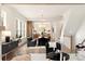 Bright open concept living room with dining room, hardwood floors, and modern decor at 1922 Hamorton Pl, Charlotte, NC 28205