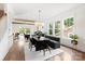 Bright open concept living room and dining room with hardwood floors and neutral colors at 1922 Hamorton Pl, Charlotte, NC 28205