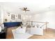 Bright loft with hardwood floors, a wet bar with blue cabinets, and modern decor at 1922 Hamorton Pl, Charlotte, NC 28205