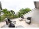 Relaxing rooftop deck with lounge chairs, cushions, and views of surrounding trees and neighborhood at 1922 Hamorton Pl, Charlotte, NC 28205