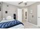 Comfortable bedroom featuring a ceiling fan and neutral decor throughout at 19613 Feriba Pl, Cornelius, NC 28031