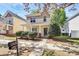 Charming two-story home featuring a welcoming front porch and well-maintained landscaping at 19613 Feriba Pl, Cornelius, NC 28031