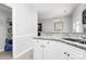 Modern kitchen with granite countertops, white cabinets, and open access to dining area at 19613 Feriba Pl, Cornelius, NC 28031