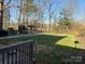 Large backyard with lush lawn, a wooden deck and covered pavilion at 1968 12Th Street Ne Pl, Hickory, NC 28601