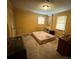 Bedroom featuring carpeted floors, built-in shelves, and natural light at 1968 12Th Street Ne Pl, Hickory, NC 28601