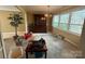 Bright dining room with a large window and an antique china cabinet at 1968 12Th Street Ne Pl, Hickory, NC 28601