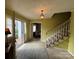 Inviting entryway featuring stairs, a light fixture, and an open doorway to the outside at 1968 12Th Street Ne Pl, Hickory, NC 28601
