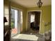 Sunlit foyer with light yellow walls, open doorway, and an antique chandelier at 1968 12Th Street Ne Pl, Hickory, NC 28601