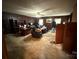 Spacious living room with a ceiling fan and wood paneled walls at 1968 12Th Street Ne Pl, Hickory, NC 28601