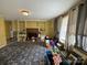 Spacious living room with a fireplace, built-in shelving, and large windows for natural light at 1968 12Th Street Ne Pl, Hickory, NC 28601