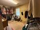 Walk-in closet with a variety of clothing on racks at 1968 12Th Street Ne Pl, Hickory, NC 28601
