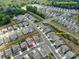 Aerial view of a residential area with houses neatly aligned and surrounded by lush greenery at 2010 Saddlebred Dr, Iron Station, NC 28080