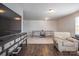Spacious finished basement with a ping pong table and comfortable seating, ideal for recreation and relaxation at 2010 Saddlebred Dr, Iron Station, NC 28080
