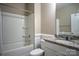 Clean bathroom featuring a shower-tub combo, granite vanity, and white cabinetry at 2010 Saddlebred Dr, Iron Station, NC 28080