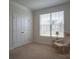 Cozy bedroom with large window, neutral tones, and ample closet space at 2010 Saddlebred Dr, Iron Station, NC 28080