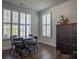 Elegant dining room featuring plantation shutters, modern lighting, and hardwood floors at 2010 Saddlebred Dr, Iron Station, NC 28080