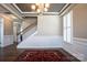 Elegant entryway with tray ceilings, chandelier and wainscoting for sophistication at 2010 Saddlebred Dr, Iron Station, NC 28080