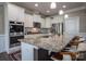 Contemporary kitchen featuring a large island, stainless appliances, and ample cabinet space at 2010 Saddlebred Dr, Iron Station, NC 28080