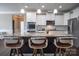 Spacious kitchen island with seating, stainless steel appliances, and granite countertops at 2010 Saddlebred Dr, Iron Station, NC 28080