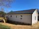 Side view of the house with a wooden deck in the backyard at 2037 Powerline Dr, Gastonia, NC 28054
