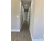 Hallway with long dark floor and white walls at 2037 Powerline Dr, Gastonia, NC 28054
